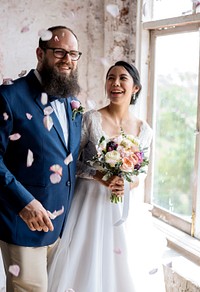 Cheerful Newlywed Couple Throwing Confetti Wedding Ceremony
