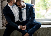 Gay Couple in Navy Blue Tuxedo Sitting Together