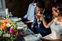 Newlywed African Descent Couple Kissing Hands