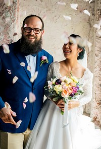 Cheerful Newlywed Couple Throwing Confetti Wedding Ceremony