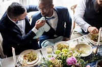 Newlywed gay couple at wedding reception