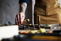 Closeup of carpenter man working with tools equipment set