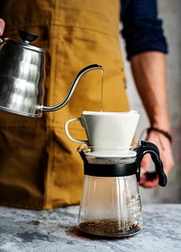 Barista making drip coffee