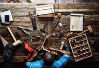 Aerial view of carpenter man working with tools equipment set