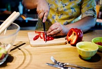 Hands cutting and preparing to cook