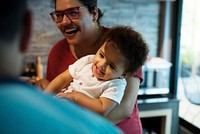 Parents playing with little girl