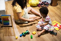 Sisters playing with building blocks