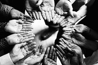 Closeup of hands in a circle 