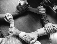 Closeup of hands in a circle 