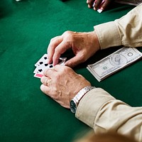 Adults socialising and playing cards 