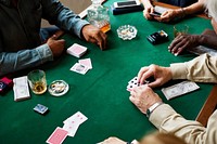 Adults socialising and playing cards 