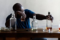 African American man drinking alcohol 