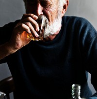 Elderly man drinking alcohol 