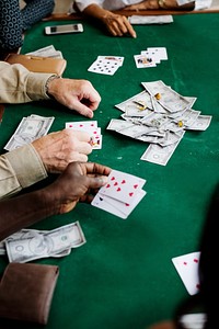 Adults socialising and playing cards 