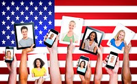 Group Of Hands of Multi-Ethnic Group Of People Holding Electronic Devices With Multi-Ethnic People's Portraits
