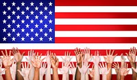 Group Of Multi-Ethnic Arms Outstretched With North American Flag As A Background.