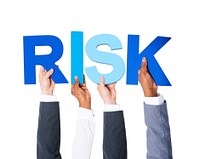 Multiethnic Business People Holding the Word Risk