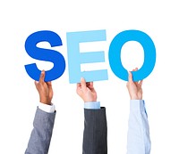 Multiethnic Business People Holding the Word SEO