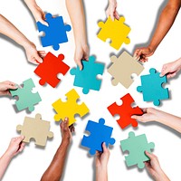 Group of Hands Holding Jigssaw Puzzle