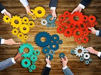 Group of Business People Holding Gears