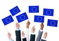Business people holding the flag of the European Union.