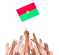 Group Of Multi-Ethnic People Reaching For And Holding The Flag Of Burkina Faso