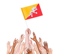Human hand holding Bhutan flag among multi-ethnic group of people's hand