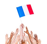 Human hand holding France Flag among multi-ethnic group of people's hand