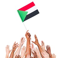 Group Of Multi-Ethnic People Reaching For And Holding The Flag Of Sudan