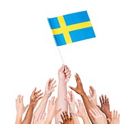 Human hand holding Sweden flag among multi-ethnic group of people's hand