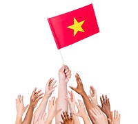 Human hand holding Vietnam flag among multi-ethnic group of people's hand