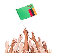 Human hand holding Zanbia Flag among multi-ethnic group of people's hand