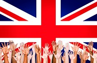 Multi-Ethnic Hands Raised With British Flag As A Background