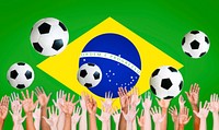 Raised Arms and Brazilian Flag as a Background for World Cup