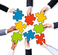 Group of Hands with Jigsaw Puzzle