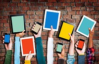 Group of Hands Holding Digital Devices