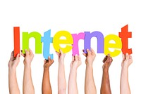 Multi-Ethnic Group Of People Holding The Word Internet