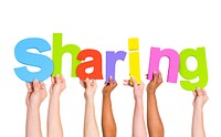 Multi-Ethnic Group of Diverse People Holding Letters To Form A Sharing