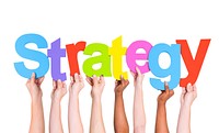 Multi-Ethnic Hands Holding Colorful Letters To Form Strategy