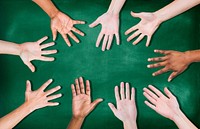 Group of Diverse Multiethnic Hands on a Blackboard