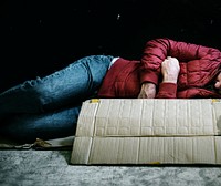 Homeless man sleeping out in the cold
