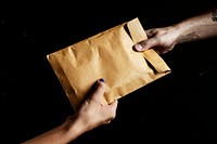 Handing out a brown envelope