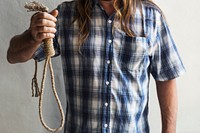 Guy holding a broken suicide rope