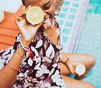 Closeup of black woman sitting by the pool