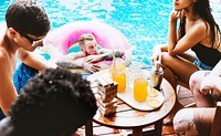 Group of diverse friends enjoying summer time by the pool