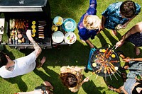 Aerial view of a diverse group of friends  grilling barbecue outdoors 