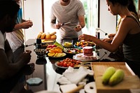 A diverse group of friends preparing barbecue in the kitchen together