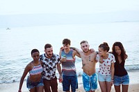 Group of diverse friends at the beach together