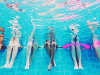 Group of people legs underwater