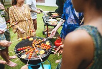 Aerial view of a diverse group of friends grilling barbecue outdoors 